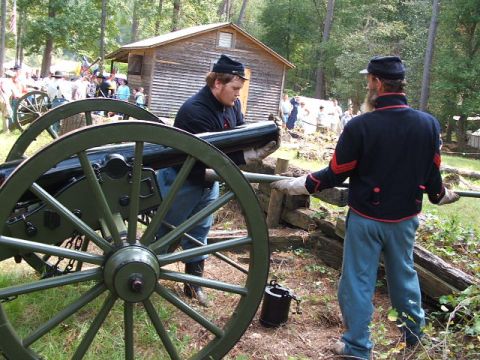 1966 Ford Ranchero - Reenactors prepare a cannon for display at a historical event.