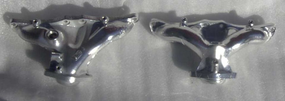 Two chrome exhaust manifolds, one on the left and one on the right