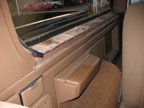 1991 Ford Bronco - Close-up view of the interior trim and seat of a vehicle.