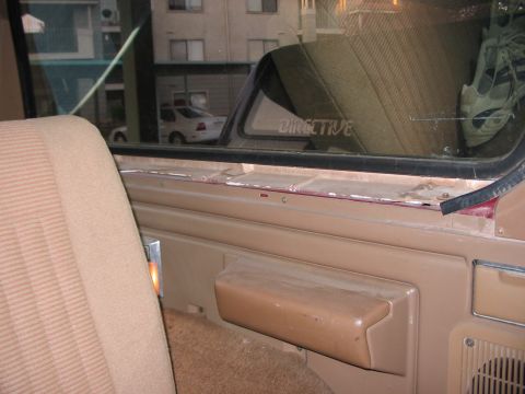 1991 Ford Bronco - Interior view of a 1991 Ford Bronco, highlighting the tan upholstery and door trim.