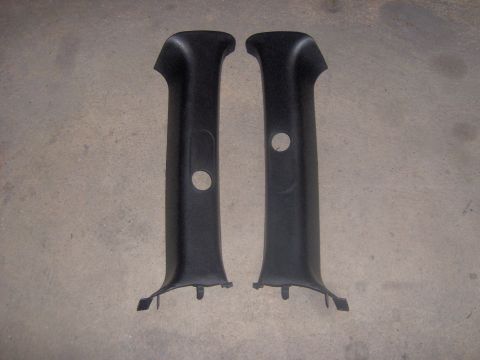 1994 Ford Probe - Two black interior trim pillars are shown against a concrete background.