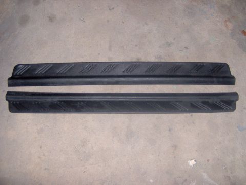 1994 Ford Probe - Pair of black plastic door sill protectors for sale, showing textured tread pattern.