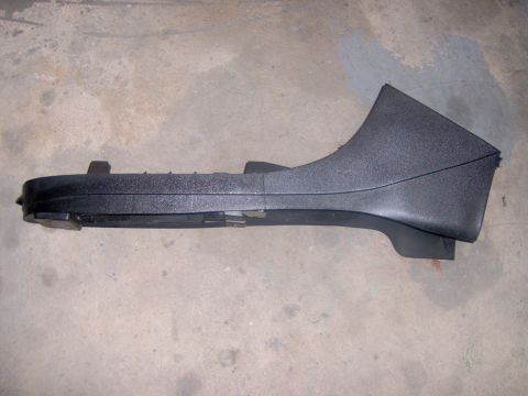 1994 Ford Probe - A black plastic interior trim piece is shown lying on a concrete floor.