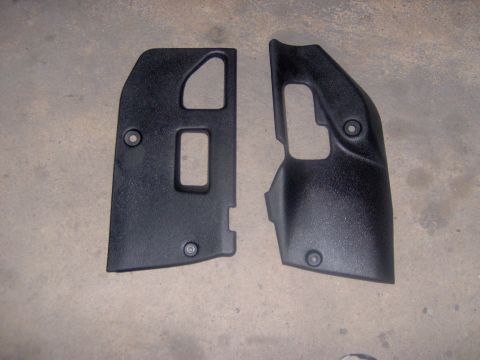 1994 Ford Probe - Two black plastic interior trim pieces with cutouts are shown against a concrete background. Text 'SUPERMOTORS' is visible at the bottom ri…