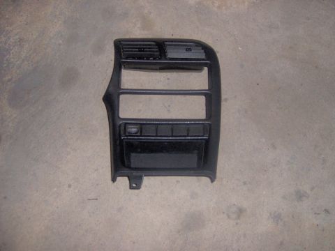 1994 Ford Probe - Black dashboard trim piece air vents and button slots, likely for a car interior.