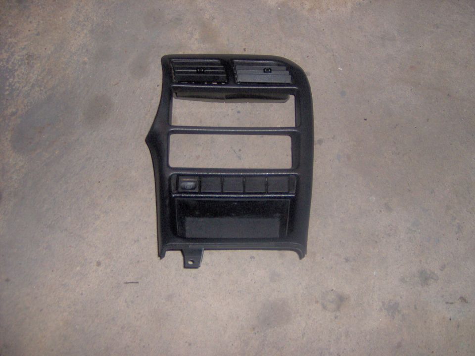 Black dashboard trim with air vents and buttons