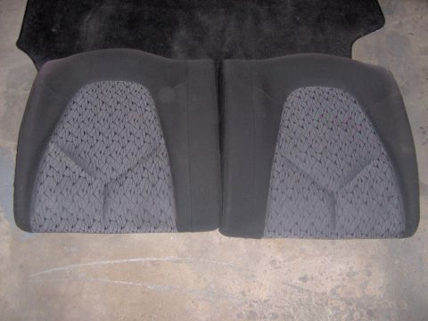 1994 Ford Probe - Pair of black interior seats with a distinctive patterned fabric insert, likely for a car.