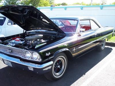 1972 Ford Ranchero - Black 1963 Ford Galaxie 500 shown with its hood open, revealing the engine bay.