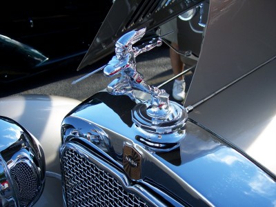 1972 Ford Ranchero - A detailed view of a chrome hood ornament and badge on a vintage automobile.