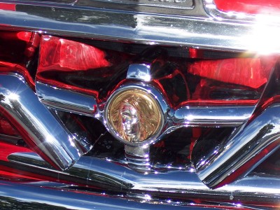 1972 Ford Ranchero - Close-up of a vehicle's front grille, a prominent chrome emblem with a profile image.