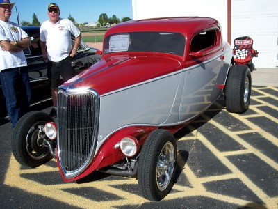 1972 Ford Ranchero - A custom hot rod with a two-tone paint job is parked outside on a sunny day.