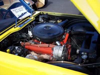 1972 Ford Ranchero - Engine bay of a yellow car, showing the V8 engine and various components.