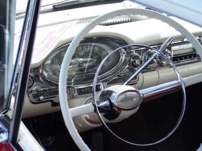 1972 Ford Ranchero - Interior view of a vintage automobile, highlighting the white steering wheel and chrome accents on the dashboard.