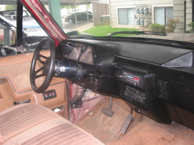 1991 Ford Bronco interior showing dashboard, steering wheel, radio, and pedals