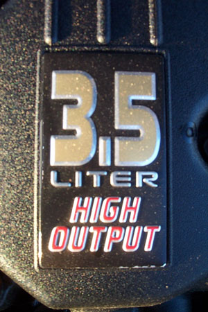 1999 Chrysler 300M - Close-up of a 3.5 Liter High Output engine badge, likely from a Chrysler vehicle.