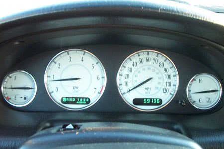1999 Chrysler 300M - Dashboard of a 1999 Chrysler 300M showing the speedometer, tachometer, and odometer reading 59136.