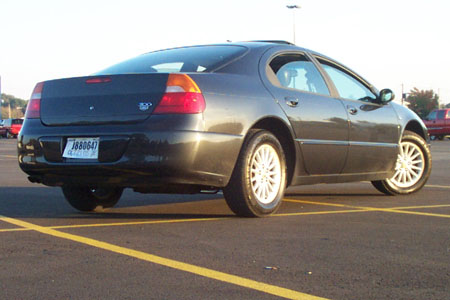 1999 Chrysler 300M - A dark gray 1999 Chrysler 300M is seen from the rear quarter angle in a parking lot.