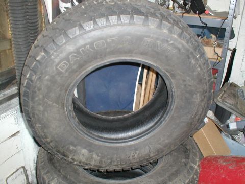 1979 Ford Bronco - A tire labeled "DAKOTA RVT" is shown, not a 1979 Ford Bronco.