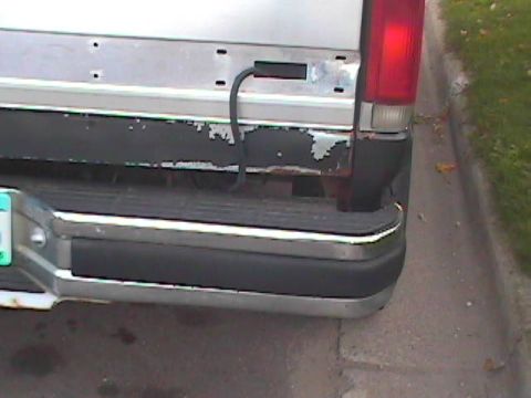 1989 Ford Bronco - Close-up view of the rear bumper and taillight assembly on a silver truck.