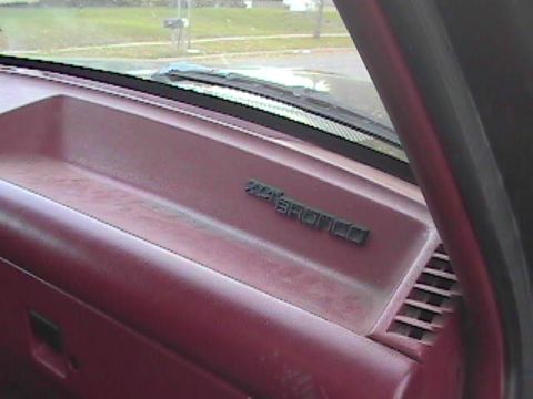 1989 Ford Bronco - The interior of a Ford Bronco shows the dashboard with the model nameplate visible.