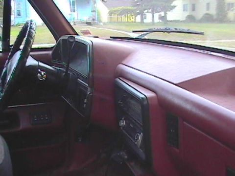 1989 Ford Bronco - Interior view of a vintage Ford truck dashboard, showing the steering wheel and radio.