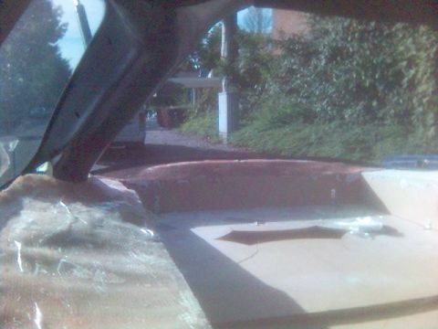 1994 Ford Probe - The interior of a vehicle is shown, with a view through the windshield to the outdoors.