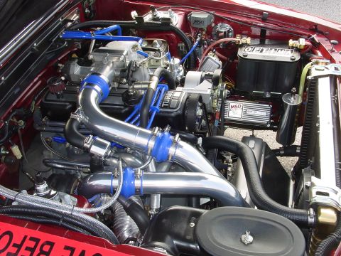 1986 Ford Mustang - Customized engine bay a turbocharger setup and performance ignition components.