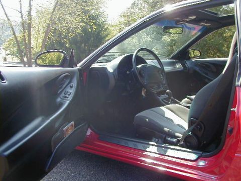 1997 Ford Probe - Interior view of a 1997 Ford Probe, highlighting the driver's side seat and dashboard.