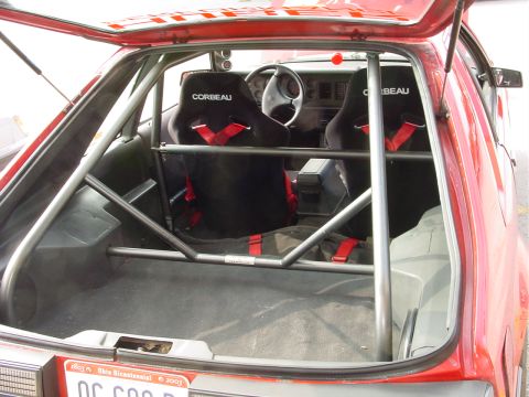 1986 Ford Mustang - Interior view of a modified 1986 Ford Mustang, racing seats and a roll cage.