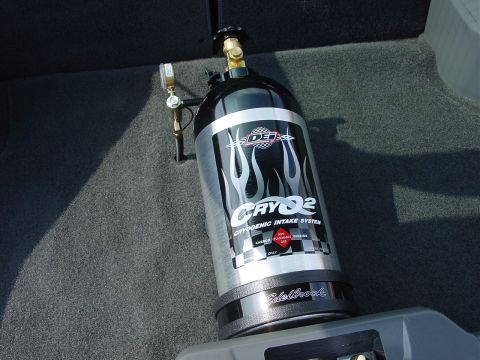 1986 Ford Mustang - Nitrous oxide tank with "CRYQ2" branding and flame graphics is visible in the car's interior.