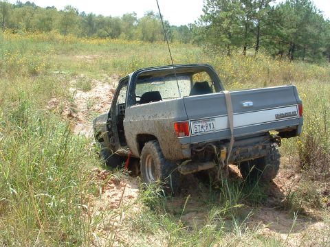 1993 Ford Bronco - This Chevrolet K5 Blazer is stuck in the mud on a dirt path.