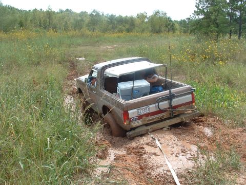 1993 Ford Bronco - This 1993 Ford Bronco is stuck deep in the mud, with its rear end facing the camera.