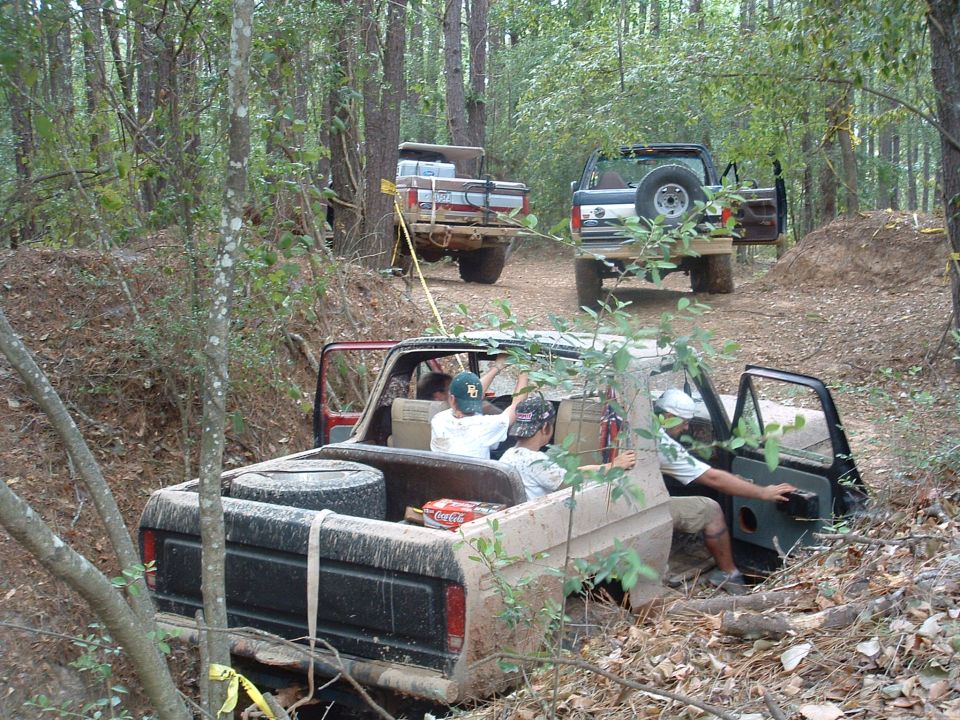 1993 Ford Bronco off-roading with other vehicles