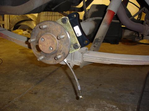 1966 Ford Fairlane - Assembly continues. Baer bracket for the caliper is on and the axle is in.