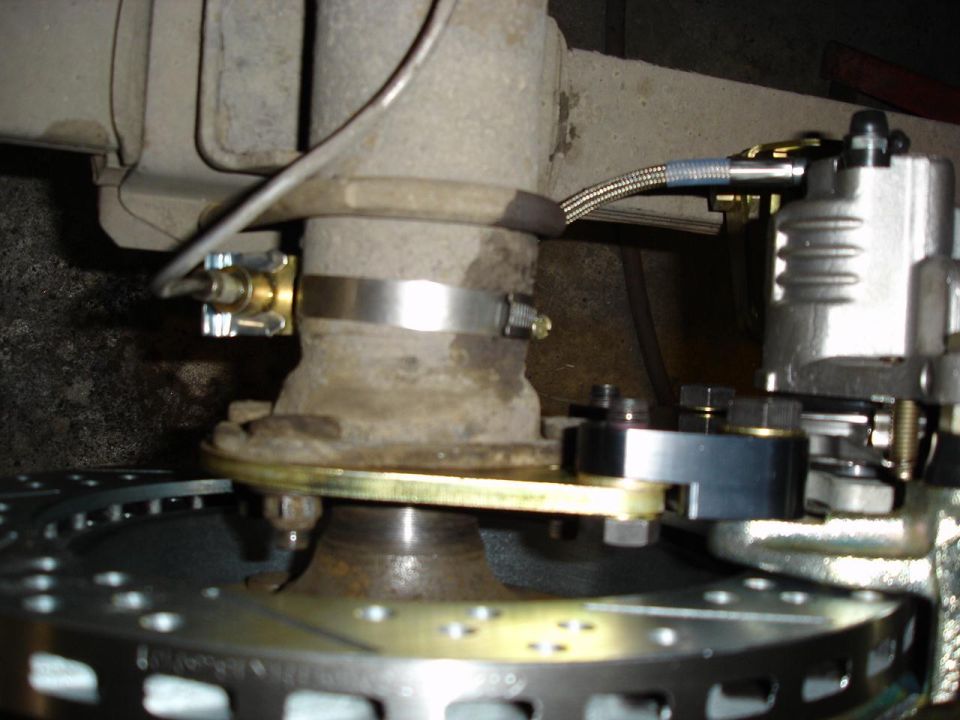 A look at the back side of the rear rotor.  Note: new mounting tabs had to be welded on to each rear subframe rail to accomodate the park cable.