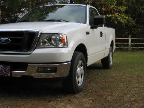 2004 Ford F-150 - Front 3/4 view of a white 2004 Ford F-150 pickup truck.