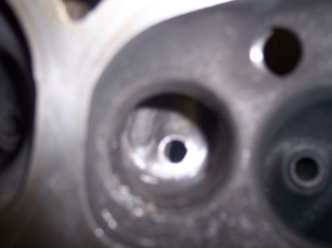 1967 Ford Mustang - This is a close-up view of an engine's cylinder head, showing internal ports.