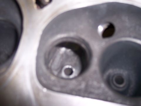 1967 Ford Mustang - Close-up view of an engine cylinder head, showing the intake and exhaust valve ports.