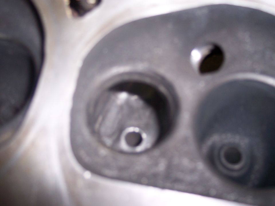 Engine cylinder head with valve seats visible