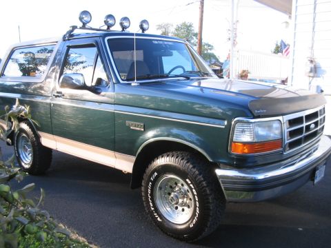 1992 Ford Bronco - This 1992 Ford Bronco is shown from the front three-quarter view with its doors and windows visible.