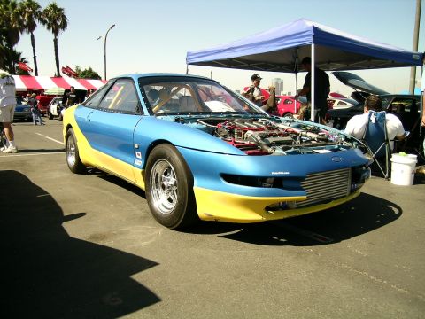 1993 Ford Probe - A modified 1993 Ford Probe sits on display with its engine exposed.