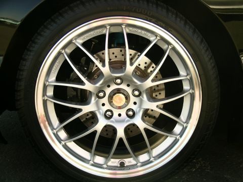 1993 Ford Probe - Close-up of a custom alloy wheel and tire assembly, showing brake components.