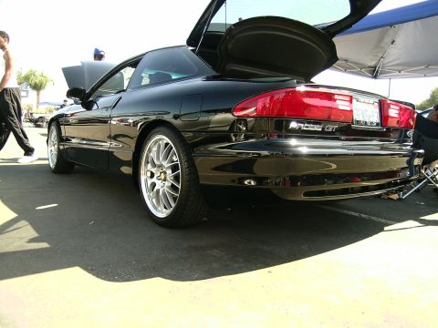 1993 Ford Probe - This 1993 Ford Probe GT is shown from the rear with its trunk open, custom wheels.
