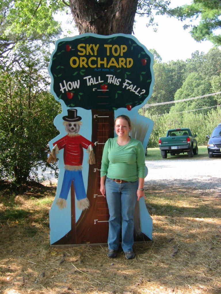 Person next to Sky Top Orchard height chart