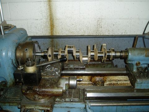 1969 Ford Bronco - Machining a crankshaft on a metal lathe in a workshop.
