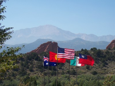 1972 Ford Ranchero - Several national flags are displayed against a backdrop of mountains and red rock formations.