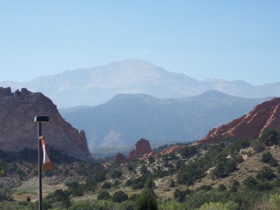 1972 Ford Ranchero - A vast mountain range stretches into the distance, framed by red rock formations and arid vegetation.