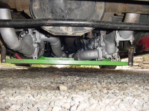 1995 Ford Mustang - Underside view of twin turbochargers and exhaust system components.