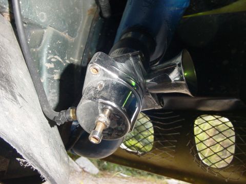 1995 Ford Mustang - Close-up of a chrome air horn attached to a blue hose, with visible green painted metal components.