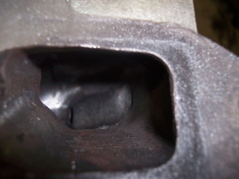 1967 Ford Mustang - Close-up view of an engine cylinder head port. The Supermotors.net logo is visible in the lower right corner.